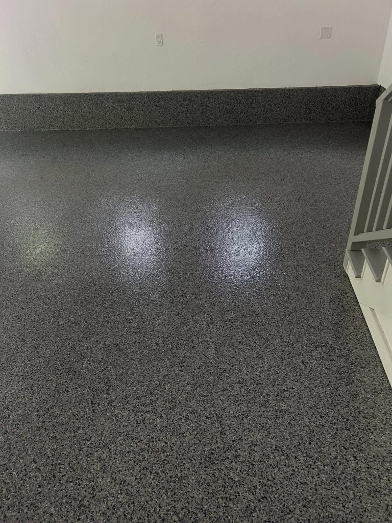 Dark grey flaked epoxy floor, close-up detail