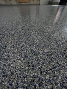 Grey and blue flaked epoxy floor, close-up detail