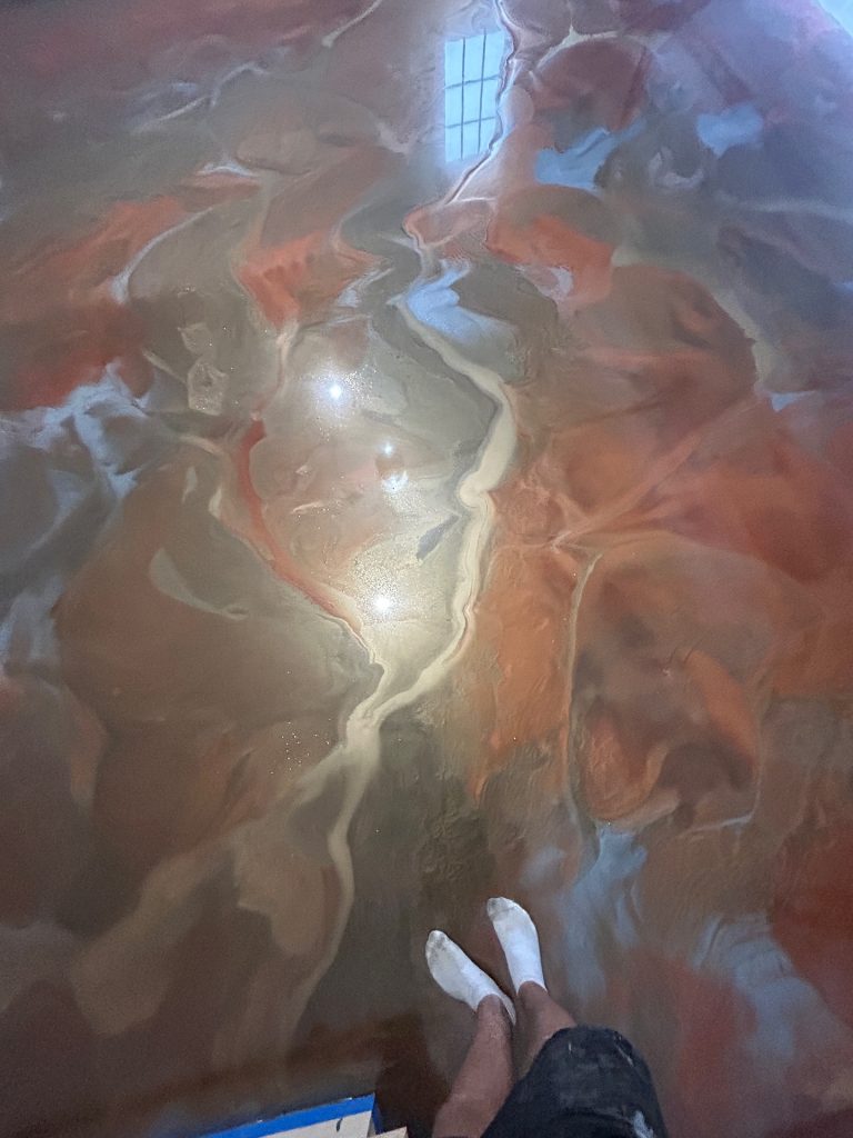 Deep copper, silver, and orange metallic epoxy floor, portrait view