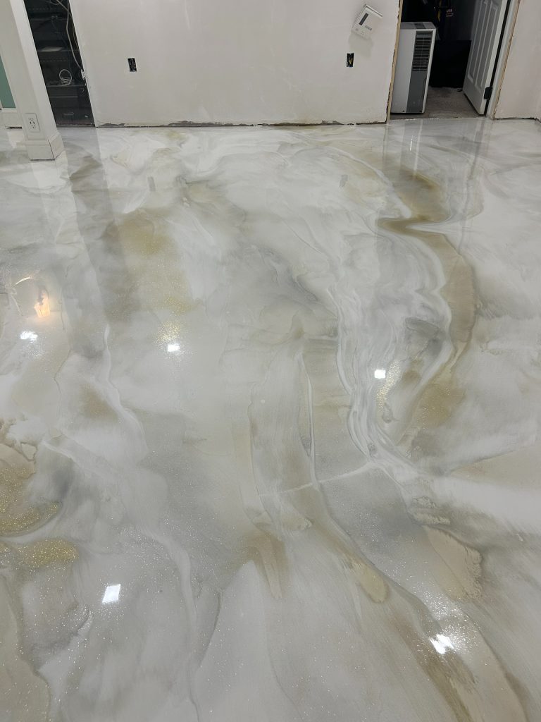 Pearl white metallic epoxy floor with gold specks, basement interior